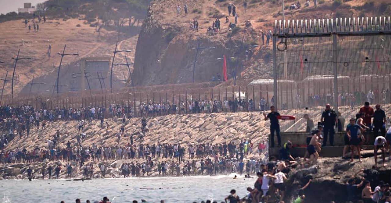 Around 60,000 migrants enter Spain’s Ceuta from Morocco; at least 34 die Around 60,000 migrants enter Spain’s Ceuta from Morocco; at least 34 die